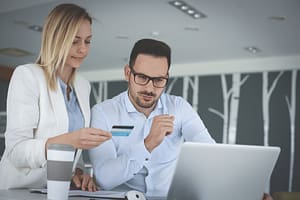 couple checking free credit reports for errors and inaccuracies