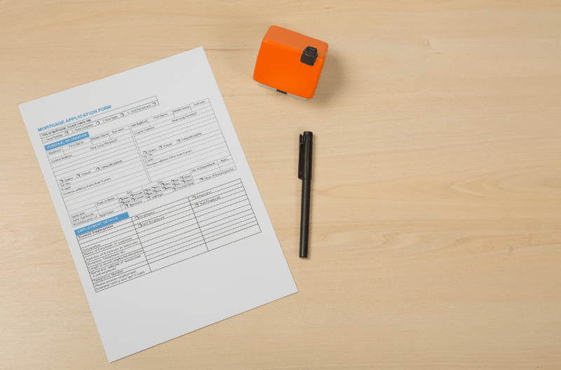 A person looking at a laptop with a mortgages prequalification form