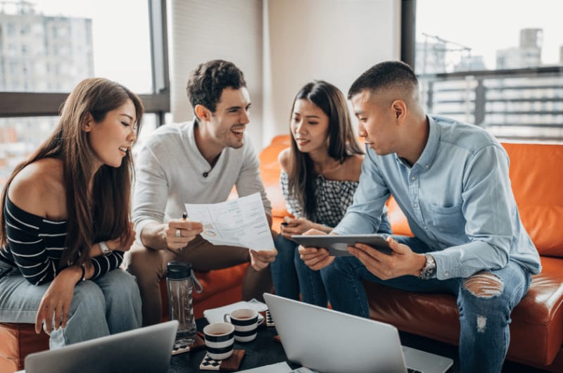 A group of millennials discussing financial decisions