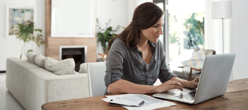 A person looking at the importance of regular credit report checks