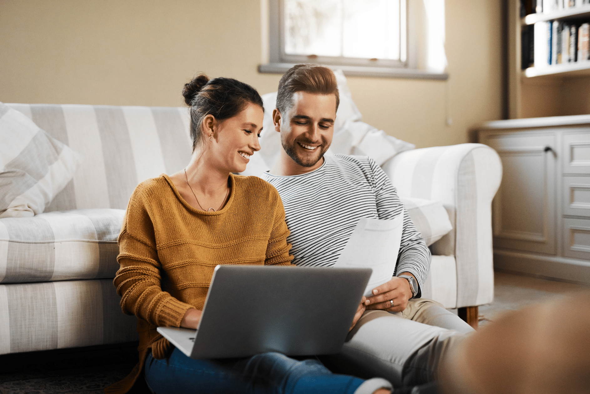 A couple looking at their credit score on their phone to rent Rent an Apartment with No Credit Checks
