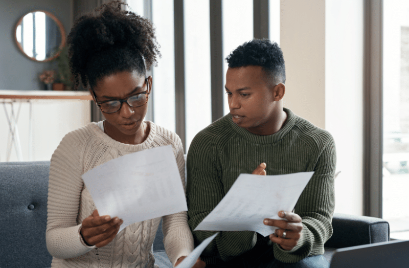 A person looking at their debt to income ratio to determine if it is a good ratio