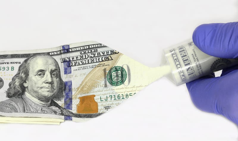 A person looking at their credit report, showing recent changes to medical debt reporting