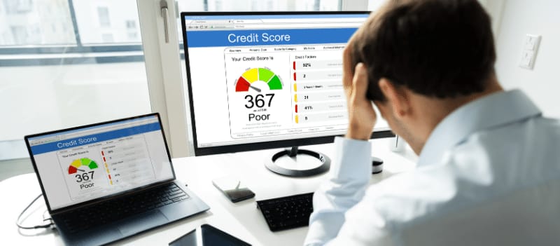 A person looking at their credit score and credit report after bankruptcy
