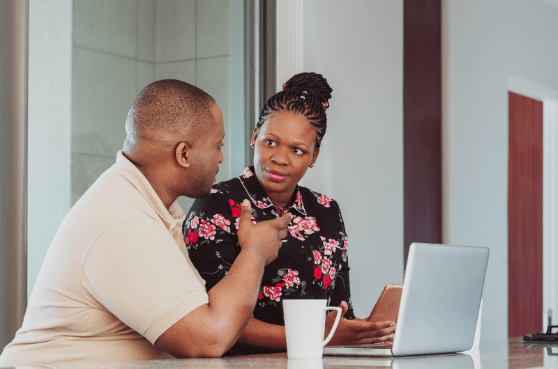 Two people discussing how to protect their credit and finances as a co-signer